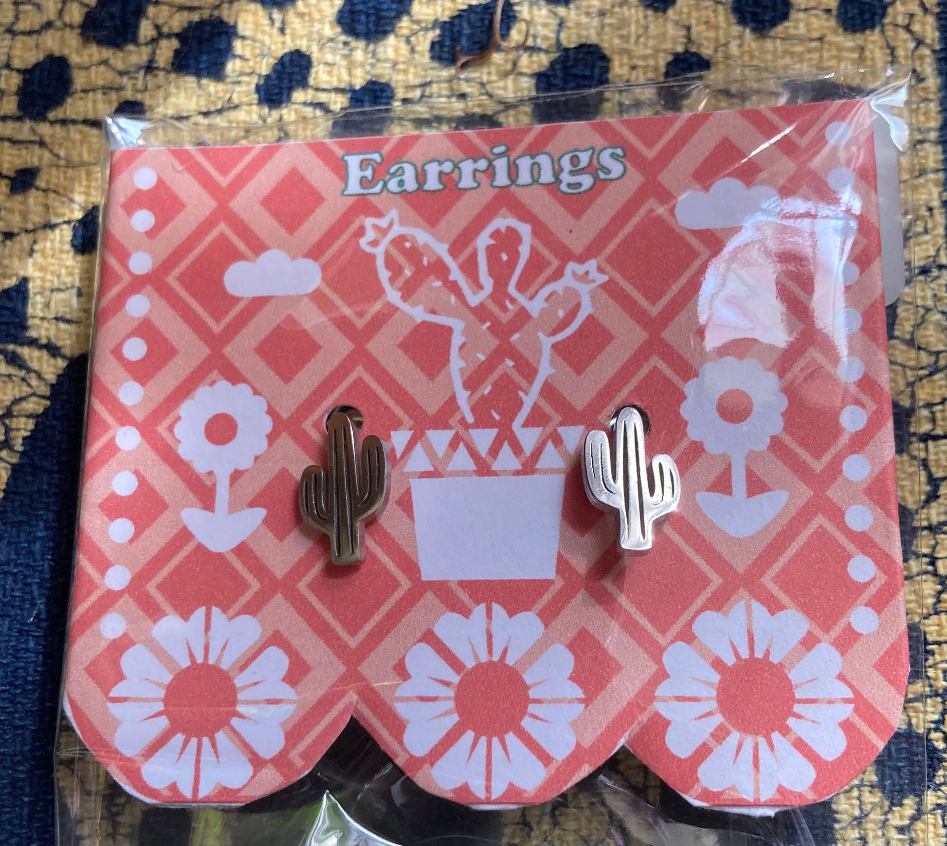 cactus earrings earrings on papel picado backdrop