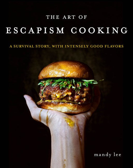 Cover image of 'The Art of Escapism Cooking: A Survival Story, with Intensely Good Flavors' by Mandy Lee, featuring a hand gripping a gourmet burger in the center, set against a sleek black background, highlighting the book's theme of culinary excellence and personal escape through cooking